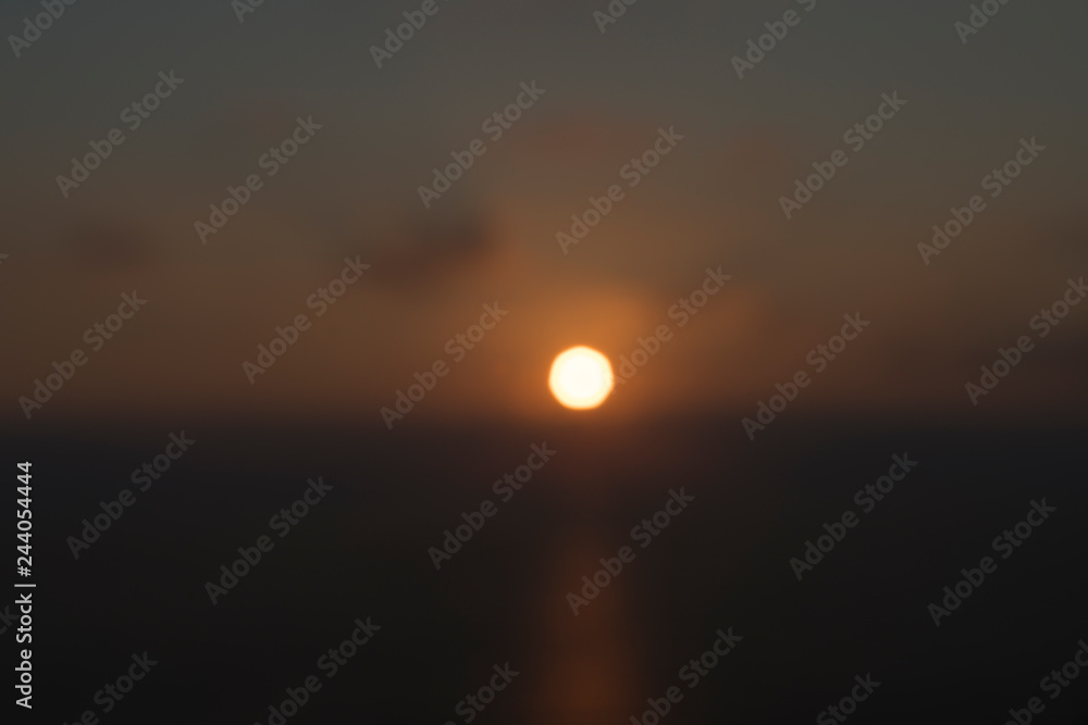 blurred sun over the ocean for backgrounds