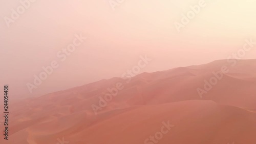 aerial view of massive sand dunes of Liwa desert in a early morning fog 