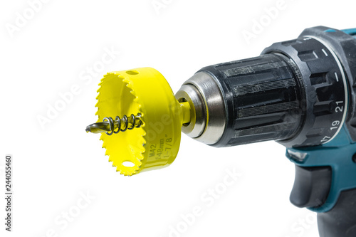 Crownwith a drill and a spring for drilling large-diameter holes