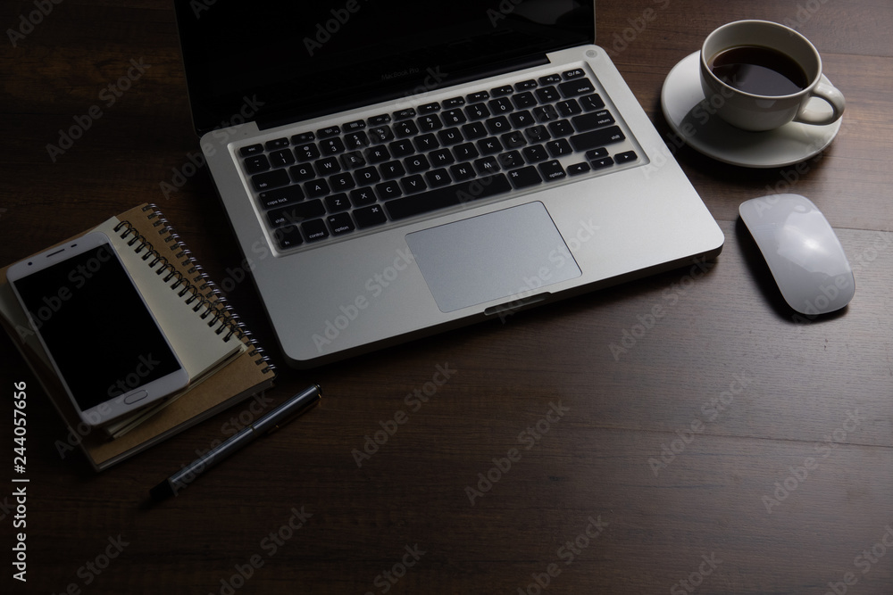 Office desk table with notebook, computer keyboard, mobile phone and other office supplies. Top view with copy space, flat lay. vintage background. Office desk table with notebook, computer keyboard, mobile phone and other office supplies. Top view with copy space, flat lay. vintage background.