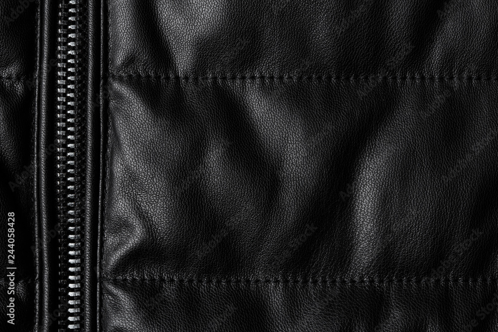 Black leather texture closeup as background. Jacket leather fabric texture. Black leather texture closeup as background. Jacket leather fabric texture.