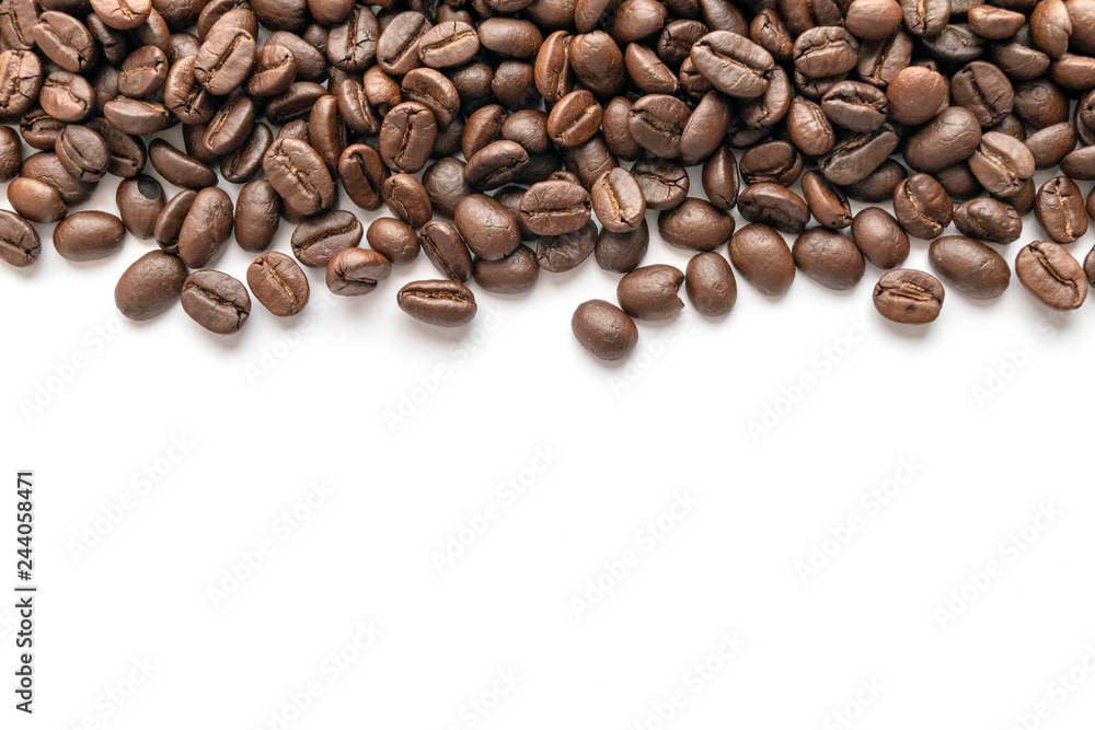 Roasted coffee beans on white background. Close-up. Roasted coffee beans on white background. Close-up.