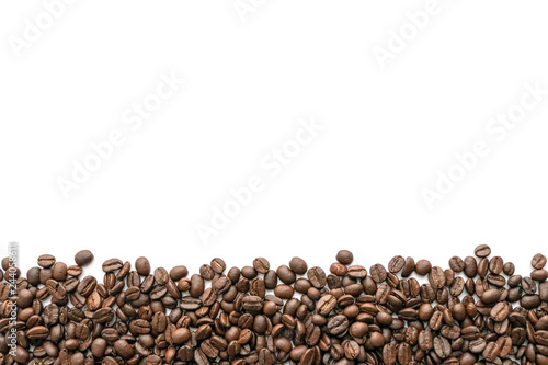 Roasted coffee beans on white background. Close-up.