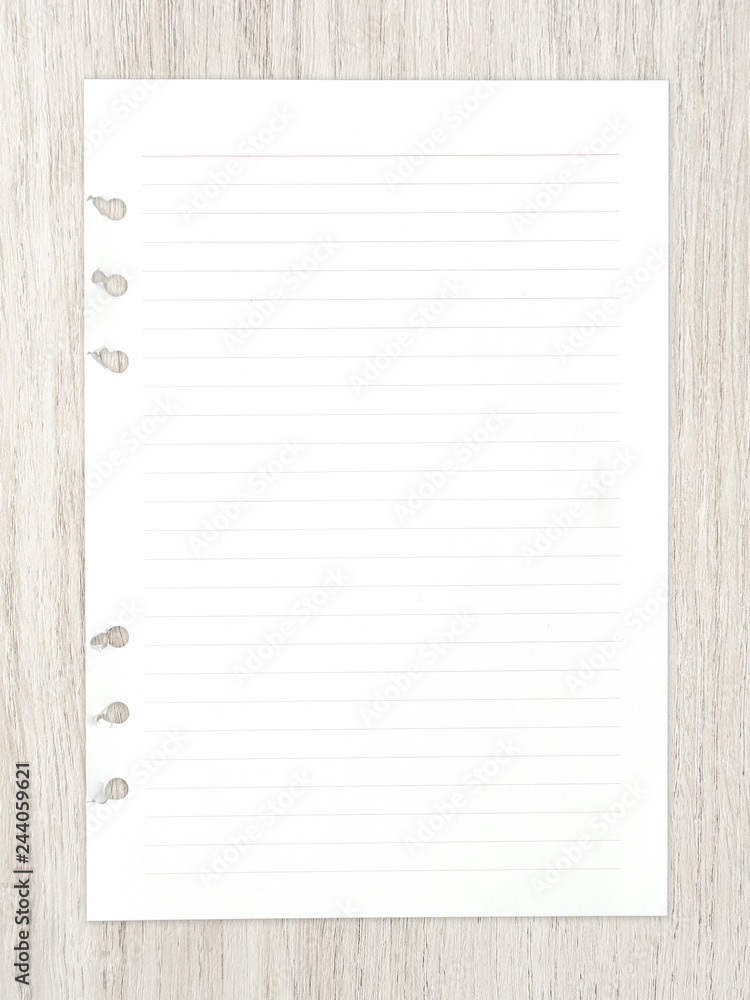 White paper sheet on wood for background. White paper sheet on wood for background.