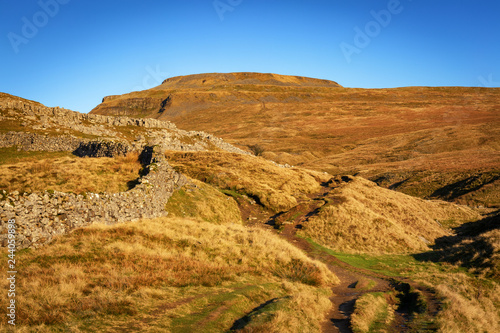 A Circular walk to Ingleborough and Whernsin the Yorkshire Dales. Head along Southerscales Scars and Humphrey Bottom two of the  3 Peaks challenge. photo