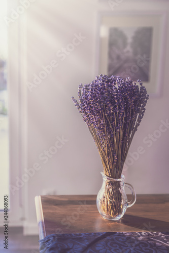 lavender in a glass on a table irradiated by the sun