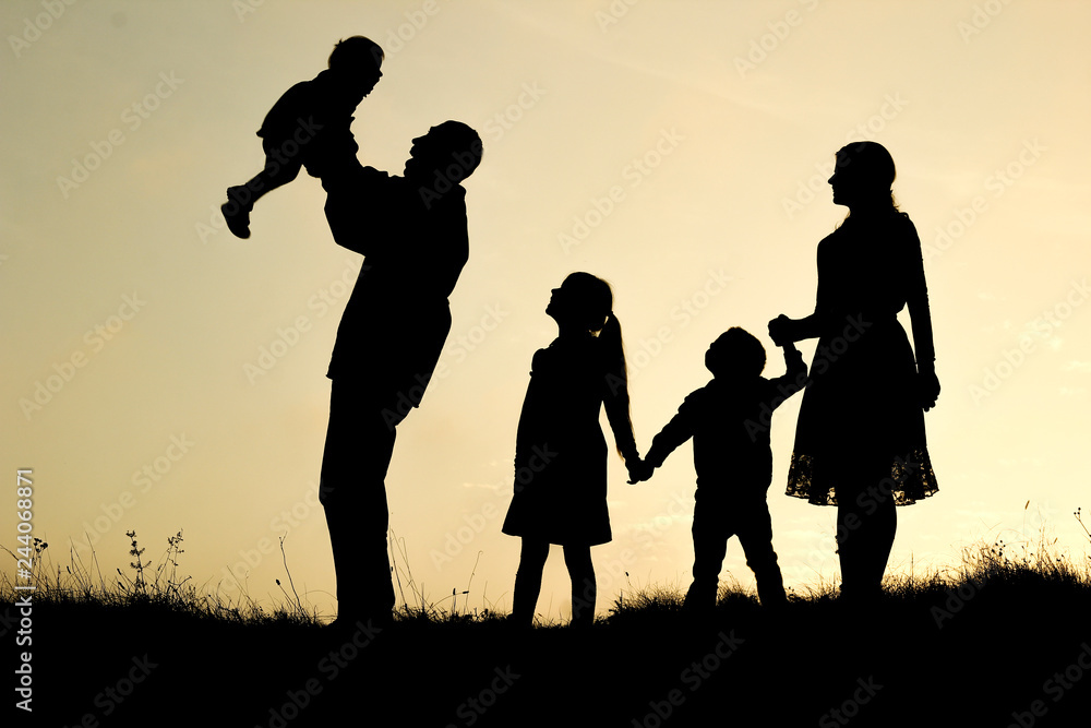 silhouette of a happy family with children