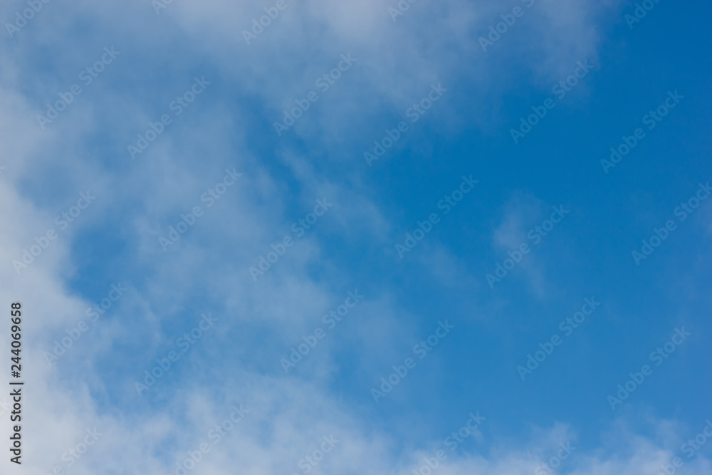 Morning sunrise. Blue sky with clouds. The morning sun illuminates the clouds. Morning sunrise. Blue sky with clouds. The morning sun illuminates the clouds.