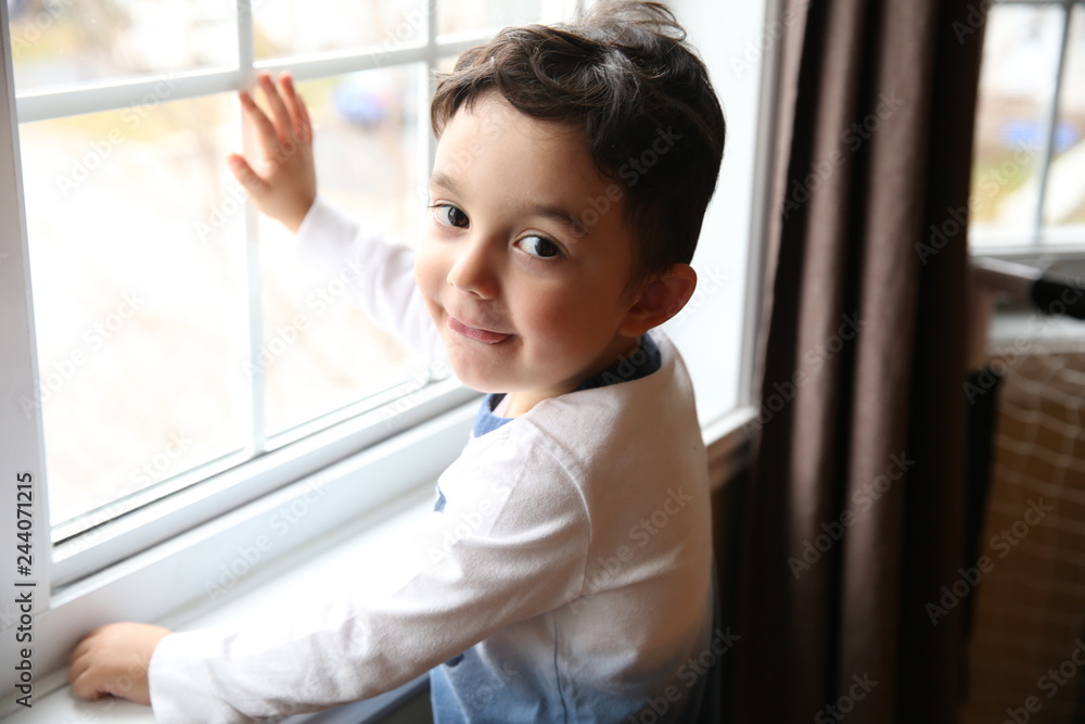 little boy in the window