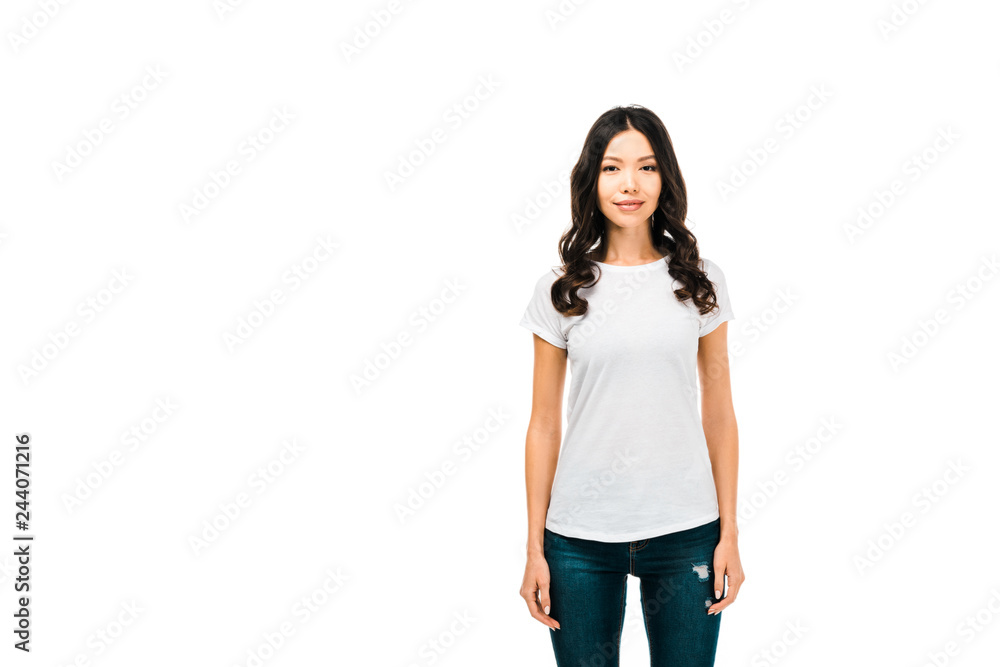 attractive young woman in white t-shirt standing and smiling at camera isolated on white attractive young woman in white t-shirt standing and smiling at camera isolated on white