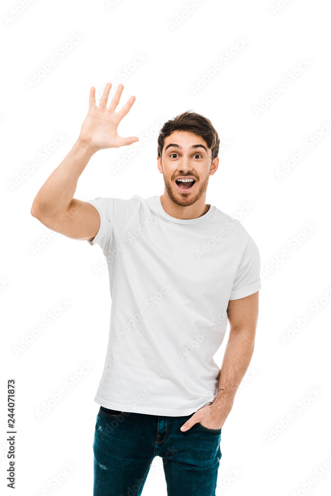 cheerful young man waving hand and smiling at camera isolated on white cheerful young man waving hand and smiling at camera isolated on white