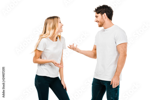 happy young couple talking and gesturing with hands isolated on white
