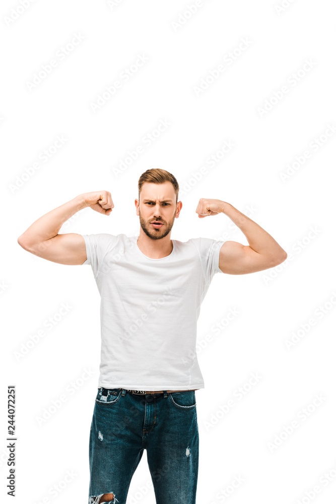 handsome bearded young man showing biceps and looking at camera isolated on white handsome bearded young man showing biceps and looking at camera isolated on white