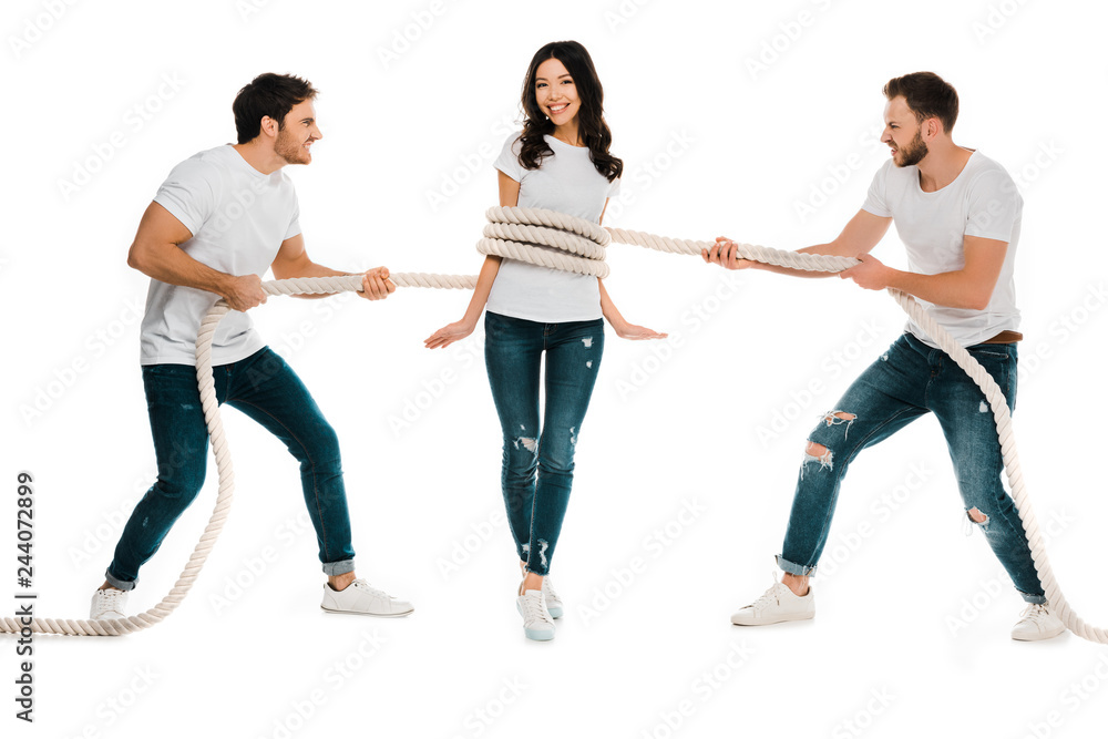 angry men pulling rope wrapped around smiling young woman isolated on white angry men pulling rope wrapped around smiling young woman isolated on white