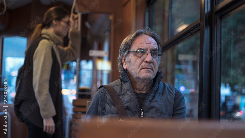 Old man sitting on the bus Old man sitting on the bus
