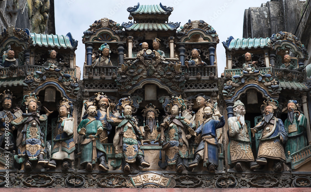 Ba Thien Hau Pagoda with ceramic figures, called smiling sculpture, because of their cheerfull, happy faces, Saigon