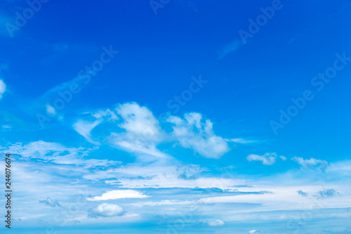 blue sky background with tiny clouds