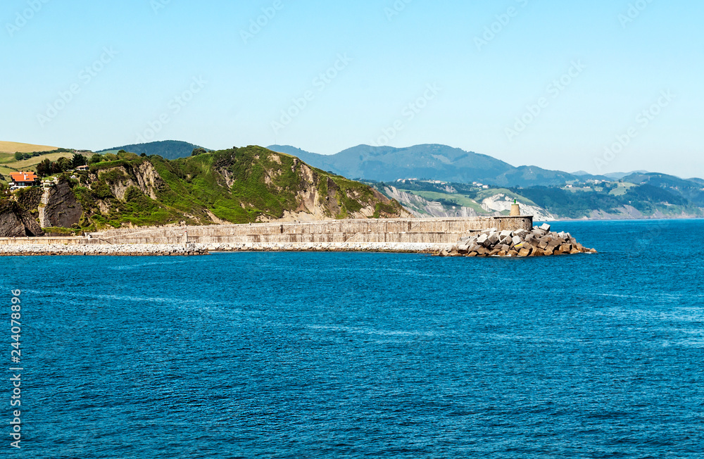 Coast in the Cantabrian sea in the Basque Country on a sunny day. Coast in the Cantabrian sea in the Basque Country on a sunny day.
