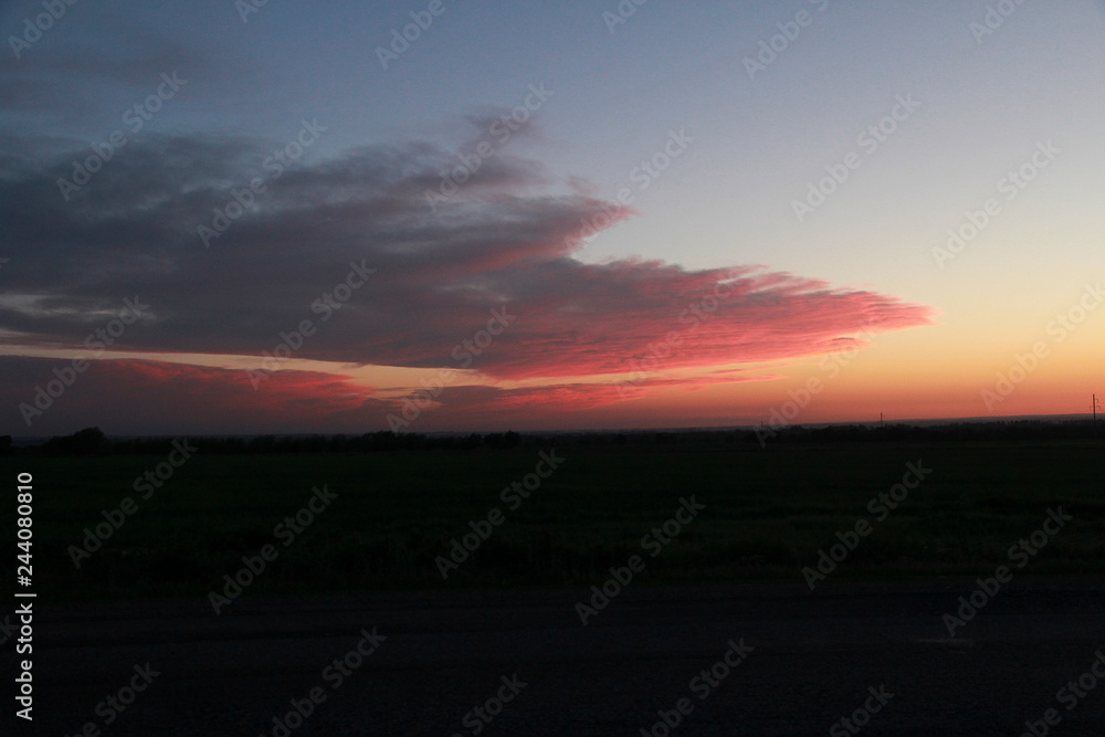 Clouds in pink sunset