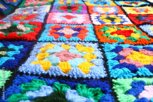 Multicolored handmade plaid of crochet made of granny squares © gabriellia