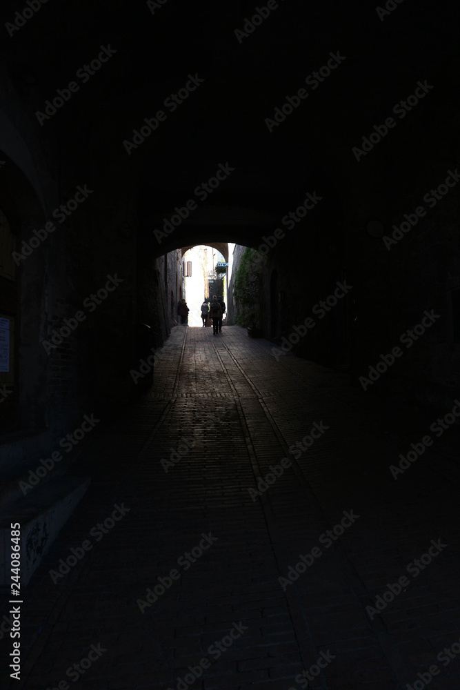 Arch on old medieval street of San Gimignano, Tuscany, Italy