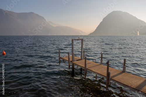 Lugano, Switzerland: The lake of Lugano as seen from the boulevard at sunset