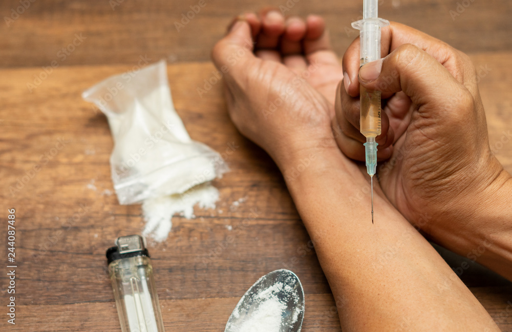 custom made wallpaper toronto digitalDrugs concept. Disease concept. Drug addict man with syringe using drugs.Dark theme, young guy very stressed, He would drug addiction.
