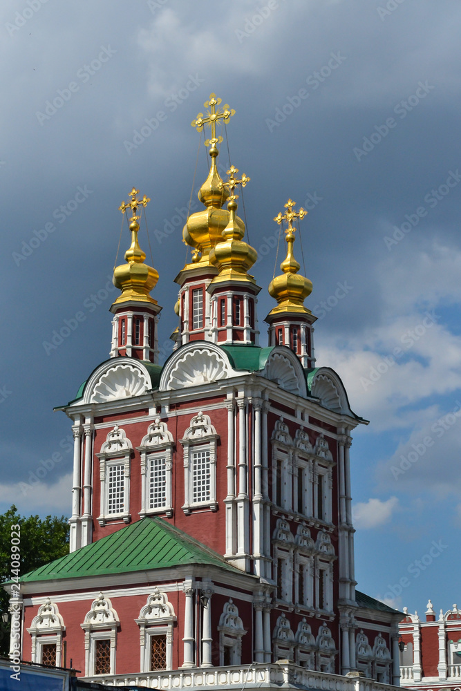 Beautiful building of the Russian Orthodox Church. Covered in gold dome. Crosses and exterior decoration. Love to God