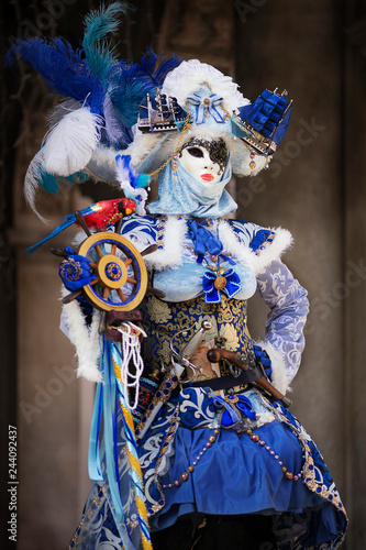 Woman in Venetian carnival outfit. Marine theme. 