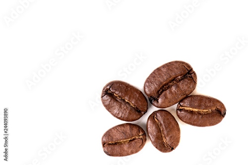 close-up of coffee beans on white background, top view