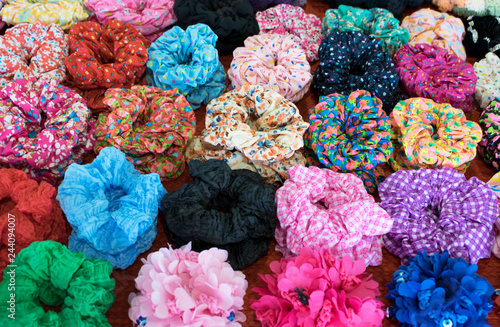 Textile scrunchy. Elastic bobble hair bands. Modern style multi-color mix pattern. Colorful mix for background