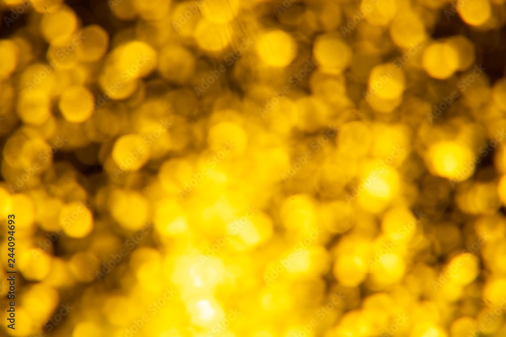 Golden glitter festive background with bokeh lights. Celebration concept for New Year, Christmas Holidays. Golden glitter festive background with bokeh lights. Celebration concept for New Year, Christmas Holidays.