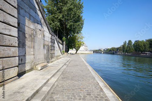 Billede på lærred Paris, empty Seine river docks with steps in a sunny summer day