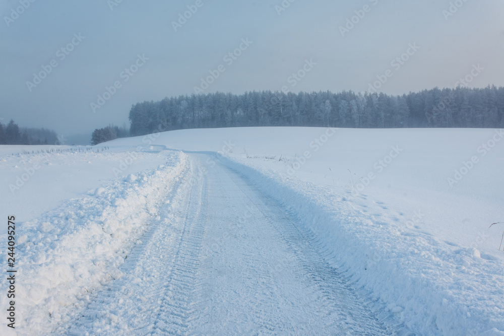 Winter landscape at sunrise with road Winter landscape at sunrise with road
