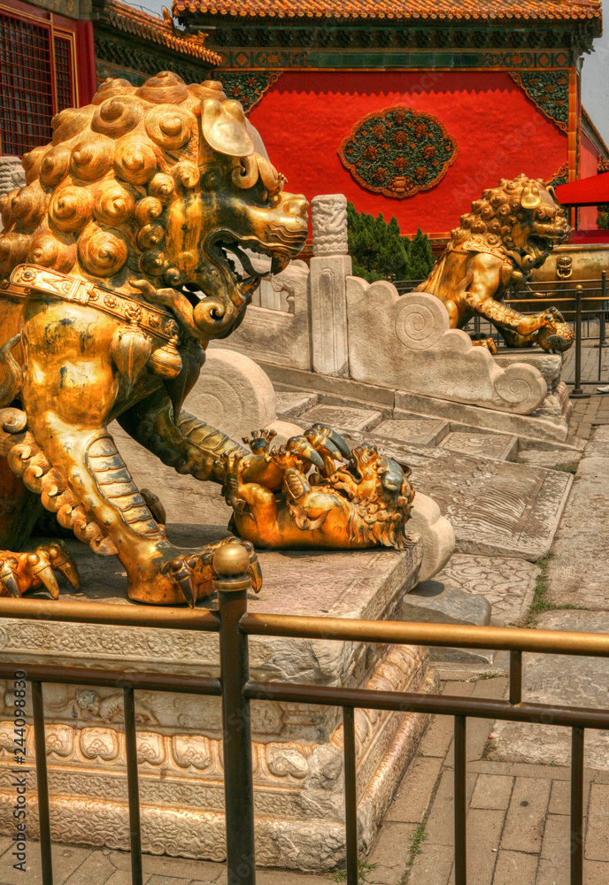 Fototapeta premium Bronze lions guarding the entrance to the Gate of Heavenly Beauty in the Forbidden City. Beijing China 