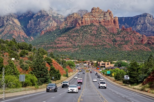 Sedona, AZ, USA: View of Sedona with clouds hovering over the red rocks in the background. photo