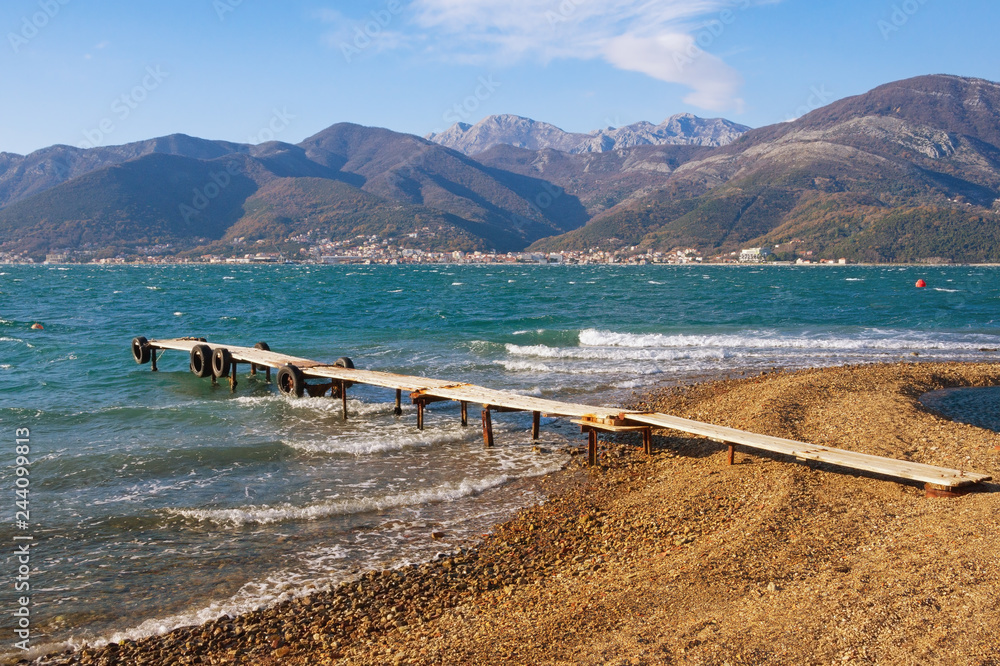 Naklejka premium Coast of Kotor Bay on a sunny winter day. Montenegro, Adriatic Sea, Bay of Kotor near Tivat city
