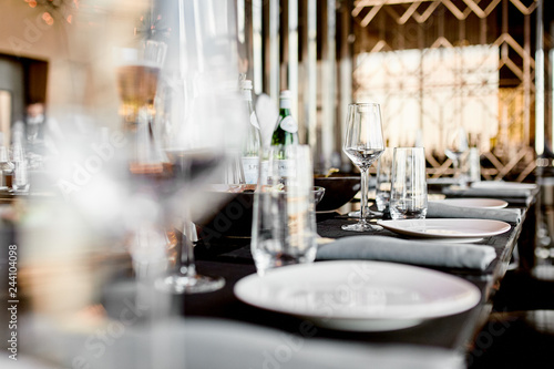 Empty glasses on the table and light table setting 