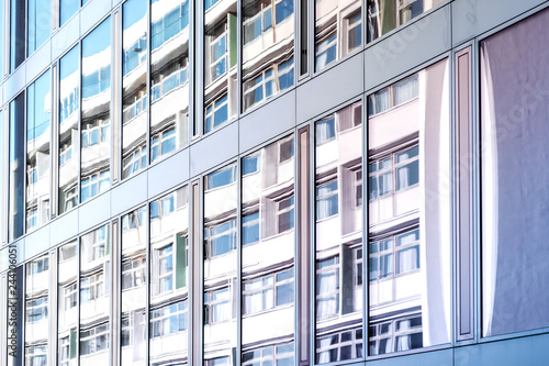 building reflection on glass facade, modern office facade