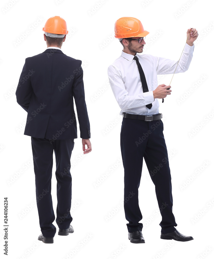 in full growth .successful architect engineer in orange helmet. in full growth .successful architect engineer in orange helmet.