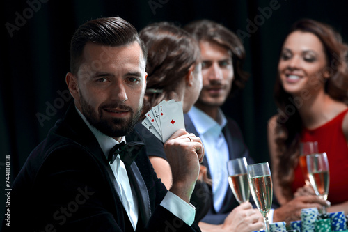 Handsome man playing in casino