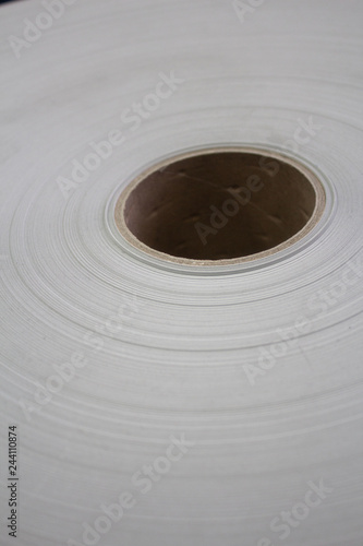 Roll of white paper on a cardboard shell