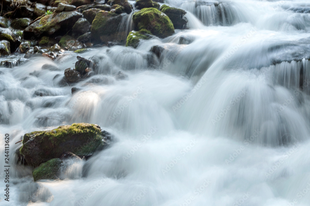 River in the mountains of the Swiss Alps in the Saint Luc valley on a sunny day. River in the mountains of the Swiss Alps in the Saint Luc valley on a sunny day.