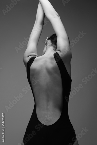 black and white photo of young woman  in black bodysuit torzo art posing beautiful skin fashion model  