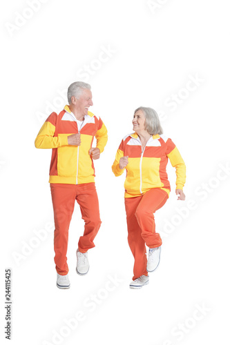 Portrait of active senior couple exercising isolated on white