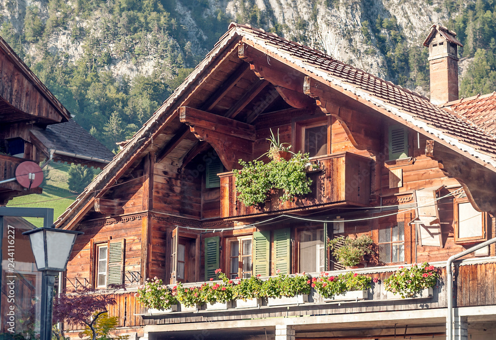Wooden houses in the meadows of the Swiss Alps in the Saint Luc valley on a sunny day. Wooden houses in the meadows of the Swiss Alps in the Saint Luc valley on a sunny day.