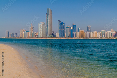 View of the skyline of Abu Dhabi from the Marina Breakwater beach, United Arab Emirates