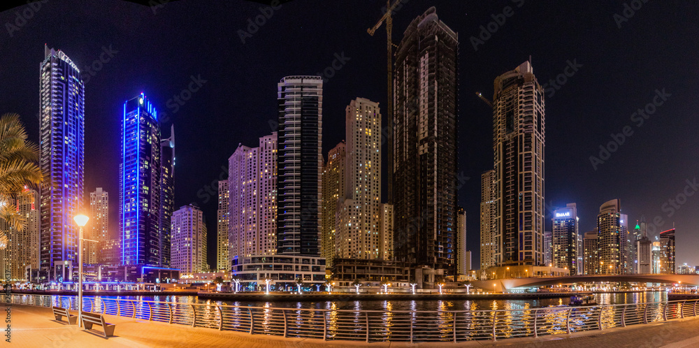 Fototapeta premium Evening view Marina Walk and Dubai Marina skyline, UAE