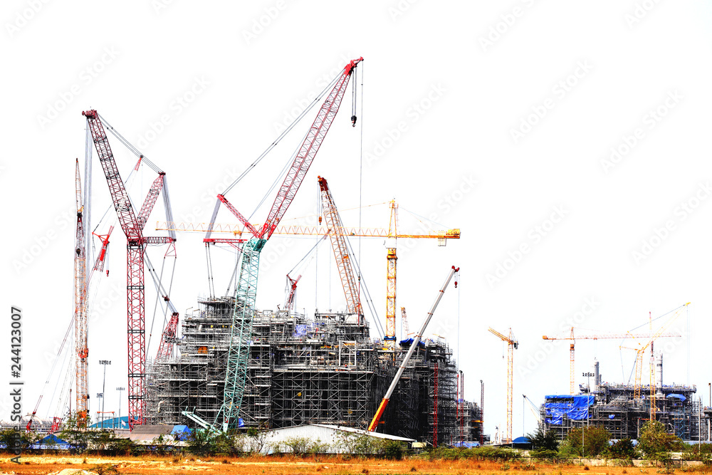 Chemical plant under construction with big crane