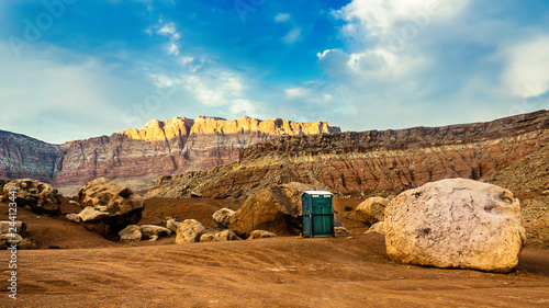 A plastic toilet in the desert.